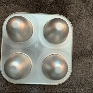 Wilton Vintage 4-cavity Mini Doll Dress cake pan.  Good used condition.